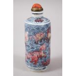 AN UNUSUAL 18TH CENTURY CHINESE BLUE & WHITE UNDERGLAZED RED PORCELAIN SNUFF BOTTLE, the body with