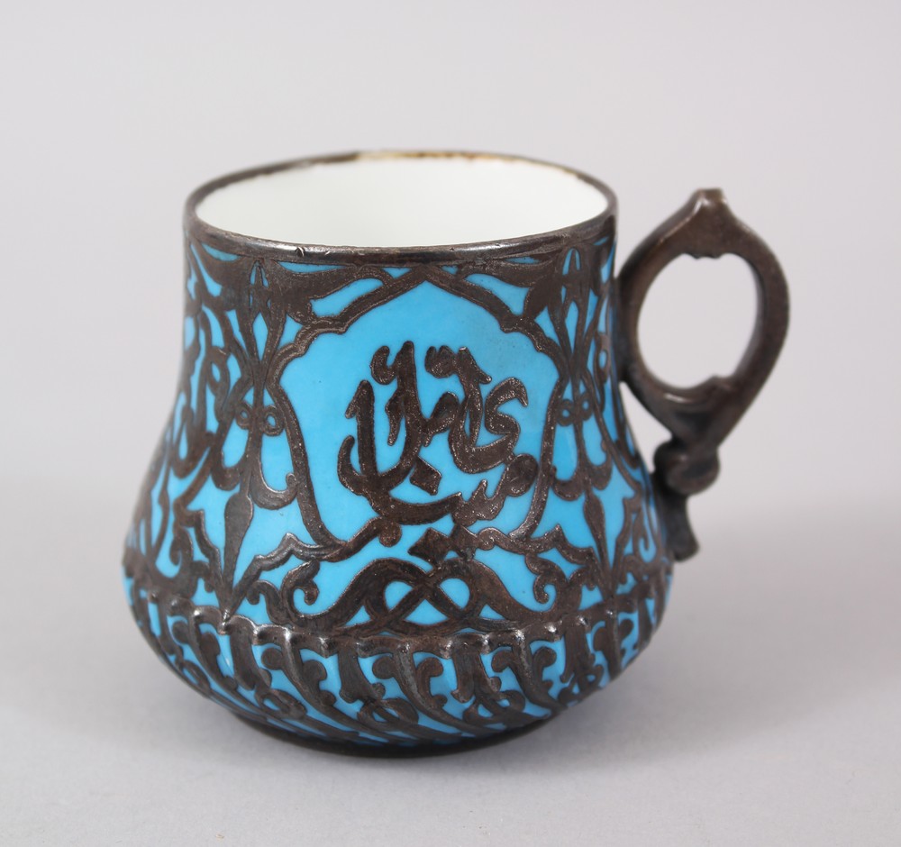 A RARE 19TH CENTURY TURKISH OTTOMAN SILVER OVERLAID YILDIZ BLUE COFFEE CUP, 6cm high.