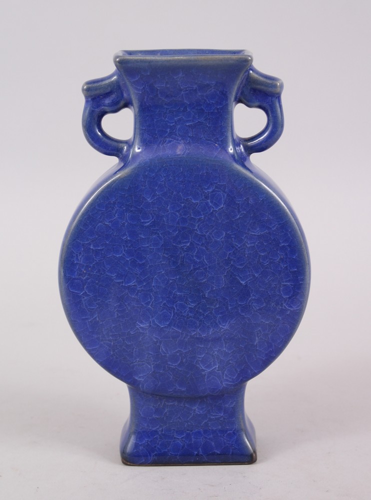 A 20TH CENTURY CHINESE COBALT BLUE CRACKLE GLAZE TWIN HANDLE MOON FLASK, the base bearing a six