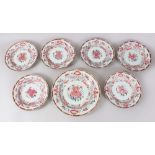 A SET OF SEVEN 18TH CENTURY CHINESE FAMILLE ROSE EXPORT PLATES, all decorated with scenes of