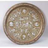 A CAIRO BRASS INLAID CIRCULAR PLAQUE decorated with figures and horses, 60cm diameter.