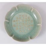 A GOOD CHINESE RU WARE CRACKLE GLAZED PORCELAIN DISH WITH CALLIGRAPHY, the scalloped edge dish