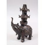 A 19TH CENTURY CHINESE BRONZE ELEPHANT INCENSE BURNER, the body of the elephant with moulded