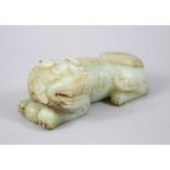 A GOOD 19TH / 20TH CENTURY CHINESE CARVED JADE LION DOG, the dog recumbent, 5.5cm high x 16cm wide.