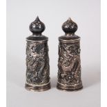 A GOOD PAIR OF 19TH CENTURY CHINESE SOLID SILVER DRAGON SALT SHAKERS, with moulded decoration of