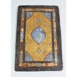 AN EARLY 16TH CENTURY PERSIAN SAFAVID QURAN BINDING, blue and gold motif, 36cm x 23cm.