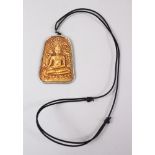 A GOOD THAI GOLD PENDANT OF A BUDDHA, the pendant impressed gold with a silver surround, the pendant