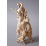 A GOOD JAPANESE MEIJI PERIOD CARVED IVORY OKIMONO - ELEPHANT AND LION GROUP, the elephant in an