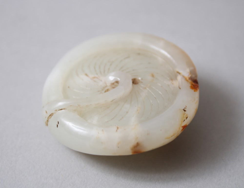 A 19TH CENTURY CHINESE CARVED WHITE JADE TOGGLE / MUSHROOM, carved in the form of a mushroom, with a
