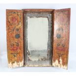 A 19TH CENTURY PERSIAN QAJAR PAINTED FOLDING TRYPTCH MIRROR, 80cm high, 82cm x 49cm.