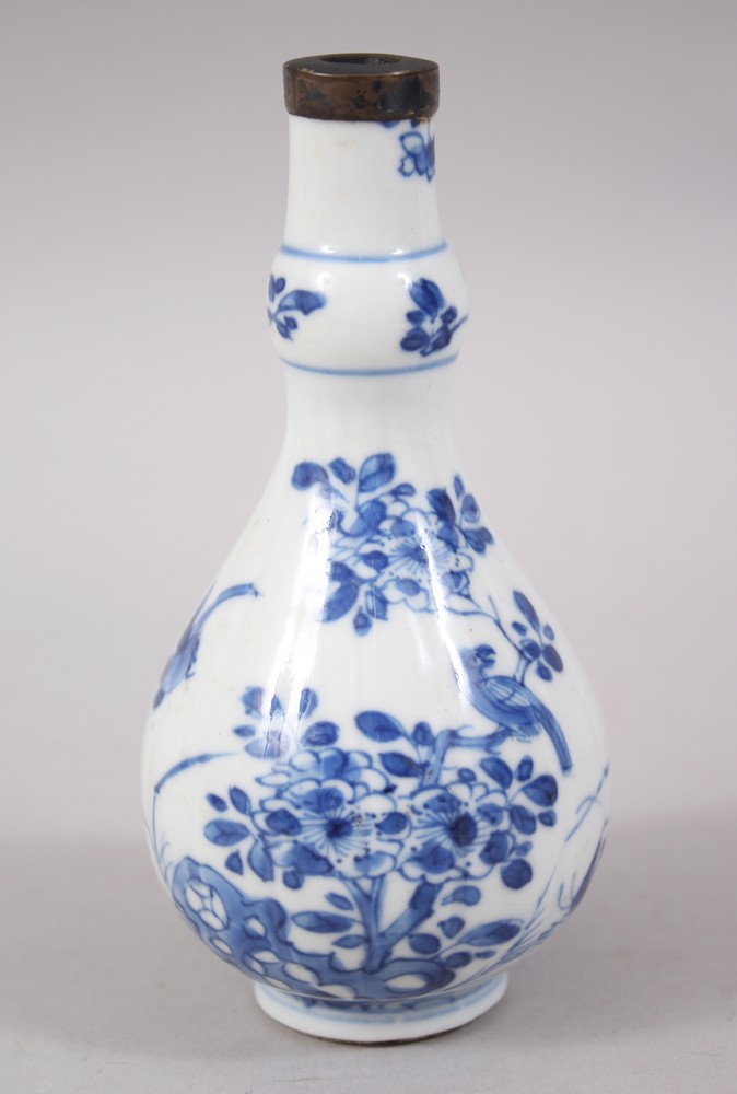 A SMALL CHINESE KANGXI BLUE & WHITE PORCELAIN BOTTLE VASE, the boy of the vase decorated with scenes