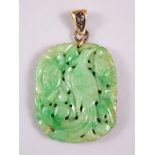 A CHINESE CARVED AND PIERCED JADEITE PENDANT OF PHOENIX BIRD, with a solid hall marked gold loupe