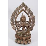 A 20TH CENTURY TIBETAN BRONZE DEITY / BUDDHA, seated upon a lotus form base, in a meditation pose,