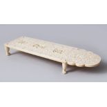 A GOOD 19TH CENTURY CHINES CANTONESE CARVED IVORY CRIBBAGE BOARD, the board with three deeply carved