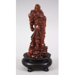 A JAPANESE MEIJI PERIOD BOXWOOD OKIMONO OF A SAMURAI WARRIOR, the body finely carved to show details