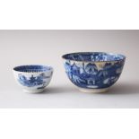 AN 18TH CENTURY CHINESE BLUE & WHITE PORCELAIN TEA BOWL, decorated with scenes of landscapes &