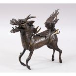 A GOOD CHINESE MING DYNASTY BRONZE QILIN INSENCE BURNER, stood in a striding pose with its mouth