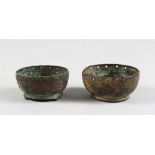 TWO 10TH CENTURY SMALL ISLAMIC GHAZNAVID BRONZE BOWLS, 7cm diameter.