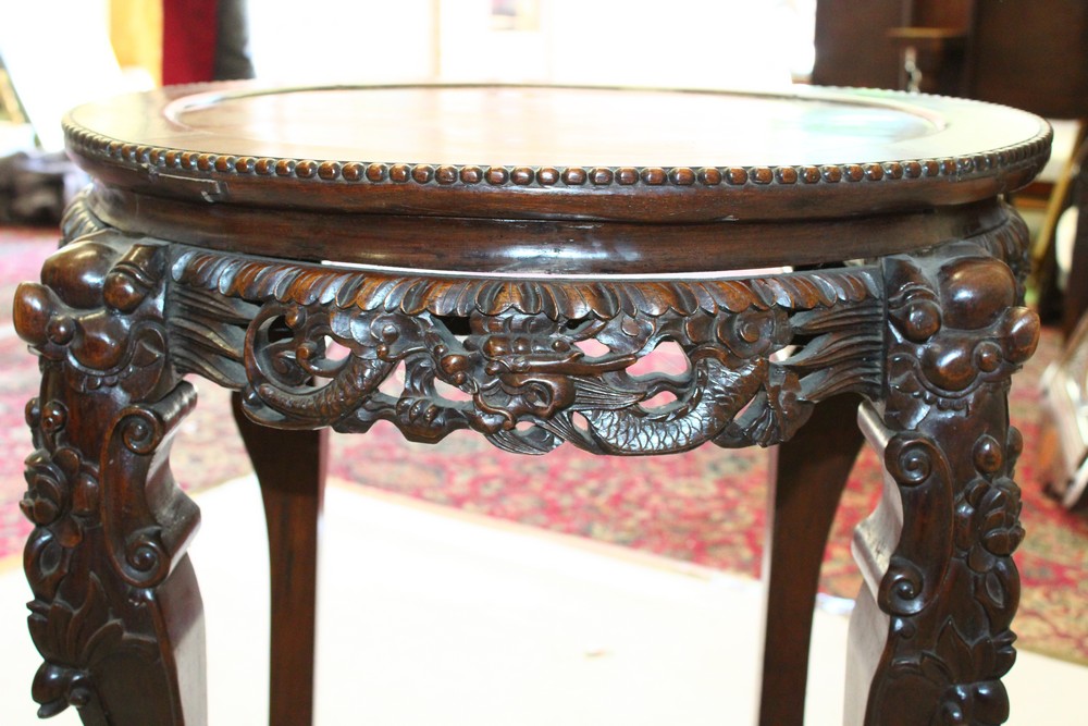 A CHINESE REDWOOD STAND, with inset hardstone top on carved legs. 73cm diameter. - Image 4 of 7