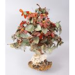 A LATE 19TH CENTURY CHINESE CARVED JADE TREE, made up of various coloured jade leaves and buds on