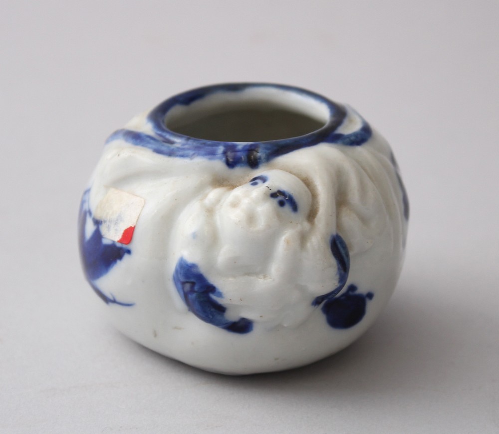 A MEIJI PERIOD JAPANESE BLUE & WHITE PORCELAIN BRUSH POT, Hotei moulded to the side, 4.5cm high, 7.