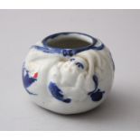 A MEIJI PERIOD JAPANESE BLUE & WHITE PORCELAIN BRUSH POT, Hotei moulded to the side, 4.5cm high, 7.