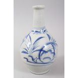 A JAPANESE MEIJI PERIOD BLUE & WHITE ARITA PORCELAIN BOTTLE VASE, decorated with sprays of