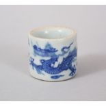 A GOOD CHINESE MING STYLE BLUE & WHITE PORCELAIN FINGER RING, with decoration of a dragon amongst