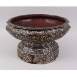 A LARGE 19TH CENTURY THAI MOTHER OF PEARL INLAID LACQUERED TWELVE SIDED PEDESTAL BOWL, 36cm diameter
