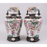 A PAIR OF LATE 19TH CENTURY CHINESE CANTON FAMILLE ROSE PORCELAIN VASES, decorated with carnival
