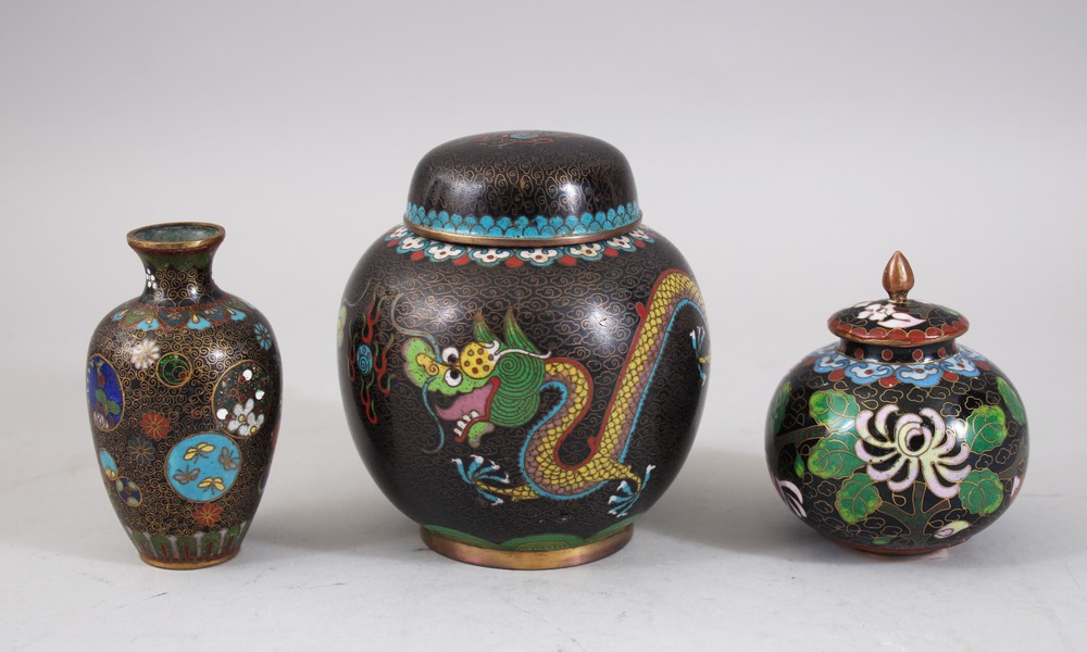 A MIXED LOT OF ORIENTAL CLOISONNE VASES / JAR, consisting of two lidded jars and one smaller vase,