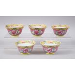 A SET OF FIVE 19TH CENTURY CHINESE FAMILLE ROSE NONYA / STRAITS TEA BOWLS, each with pink and yellow