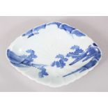 A GOOD JAPANESE 18TH CENTURY MOULDED PORCELAIN ARITA DISH, the interior moulded with scenes of a