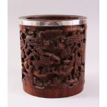 A GOOD 19TH CENTURY CHINESE CANTON SILVER RIM BRUSH POT, carved in deep relief to depict scenes of