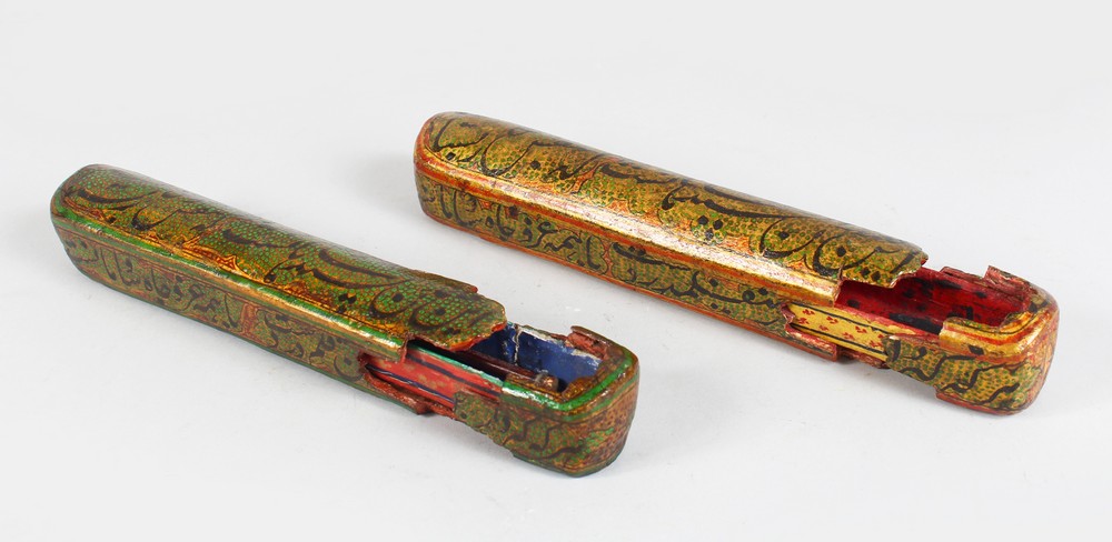 A PAIR OF 19TH CENTURY INDO PORTUGUESE QALAMDAN PAPIER MACHE PEN BOXES, 20cm long.