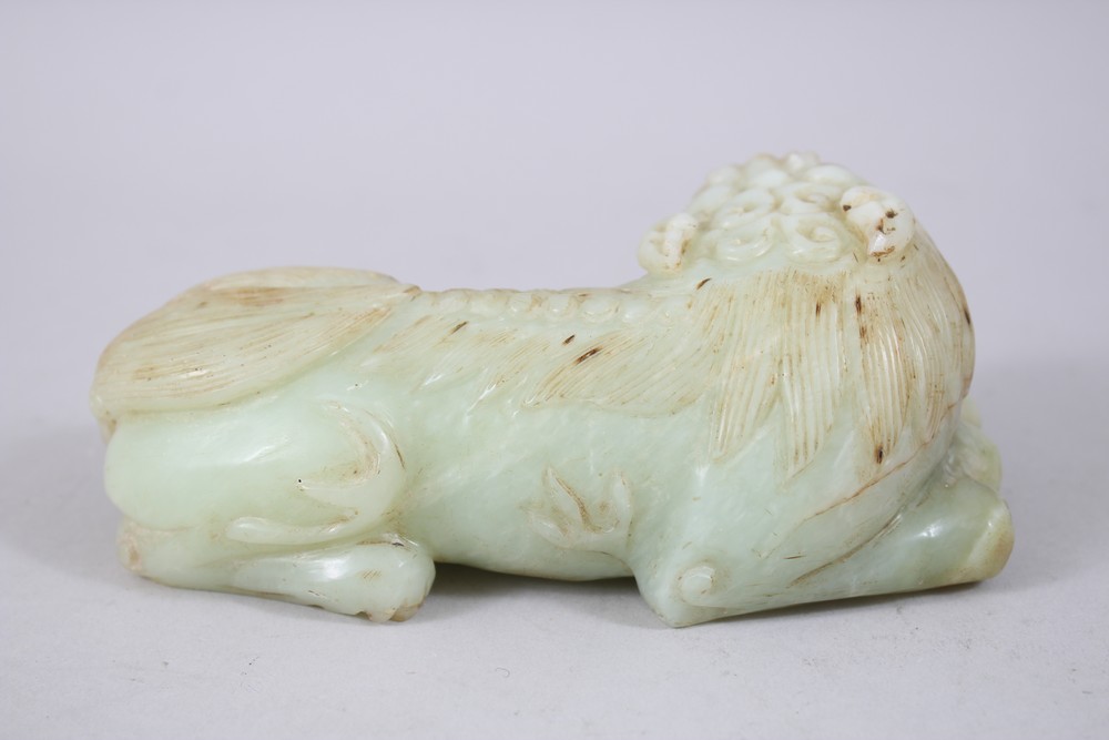 A GOOD 19TH / 20TH CENTURY CHINESE CARVED JADE LION DOG, the dog recumbent, 5.5cm high x 16cm wide. - Image 2 of 5