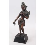 A GOOD 19TH / 20TH CENTURY NEPALESE BRONZE DEITY / BUDDHA, possibly tara, stood upon a later