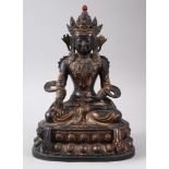 A CHINESE GILT BRONZE FIGURE OF A BUDDHA, seated upon a lotus formed base in a meditating position,