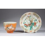 A GOOD 19TH CENTURY CHINESE ORANGE GROUND FAMILLE ROSE CUP & SAUCER, the cup and saucer matched, the