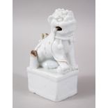 AN EARLY 18TH CENTURY CHINESE BLANC DE CHINE PORCELAIN INCENSE HOLDER OF A LION DOG, seated with its