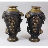 A PAIR OF CHINESE 20TH CENTURY BRONZE RELIEF VASES, the vases with applied decoration depicting