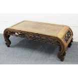 A GOOD 19TH CENTURY CHINESE HARDWOOD OPIUM / LOW TABLE, with curving sides met by a carved and