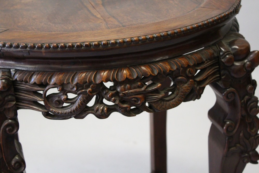 A CHINESE REDWOOD STAND, with inset hardstone top on carved legs. 73cm diameter. - Image 3 of 7