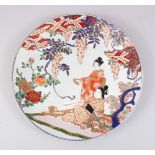 A GOOD JAPANESE MEIJI PERIOD TOKYO SCHOOL IMARI PORCELAIN CHARGER, decorated with scenes of two