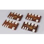 FOUR JAPANESE MEIJI PERIOD HARDWOOD & IVORY WIST GAME COUNTERS, the counters formed from hardwood