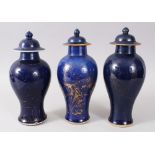 THREE 18TH CENTURY CHINESE POWDER BLUE & GILT PORCELAIN JARS & COVERS, the body of the jars with