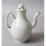 AN 18TH / 19TH CENTURY CHINESE EXPORT WHITE PORCELAIN JUG, the handle moulded in vine form, the