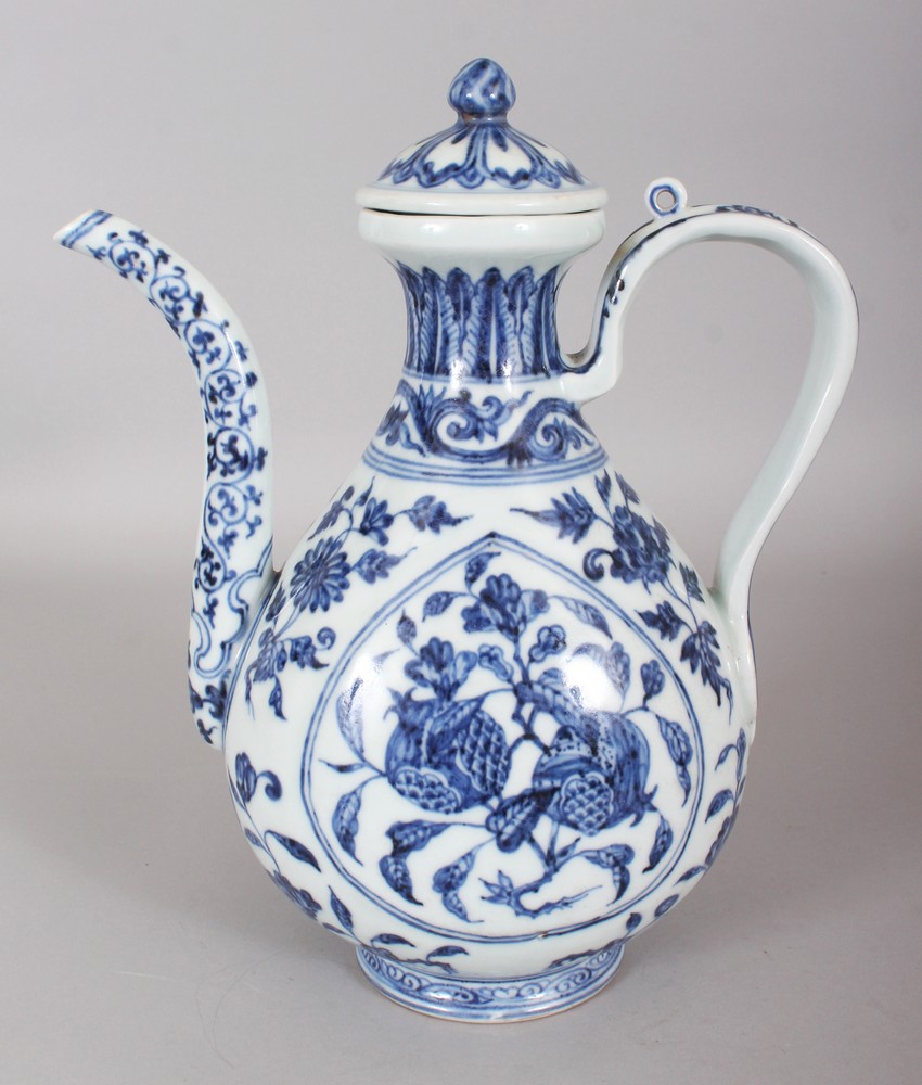 A GOOD QUALITY CHINESE MING STYLE BLUE & WHITE PORCELAIN EWER & COVER, decorated with two shaped