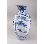 A GOOD JAPANESE MEIJI PERIOD BLUE & WHITE ARITA STYLE BALUSTER VASE, the body with two panels