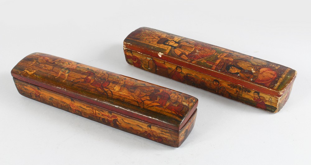 A GOOD PAIR OF LARGE QALAMDAN PAPIER MACHE PEN BOXES, 28cm long.